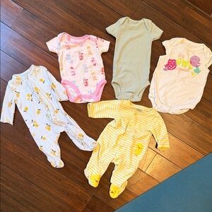 Adorable assorted newborn onsies and sleepers
